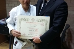 Sensei Rob Sills receives 5th Dan certificate from Brian Seabright