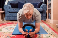 Chris Whittam using a kettlebell at home